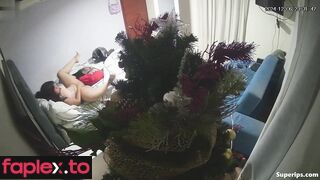 Brunette girl masturbates at Christmas