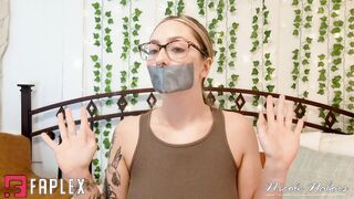 Blonde Nicole Nabors With Glasses Imitates Releasing Herself From Adhesive Tape